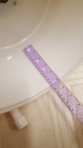 Ruler showing the width of the running surface as 5 inches